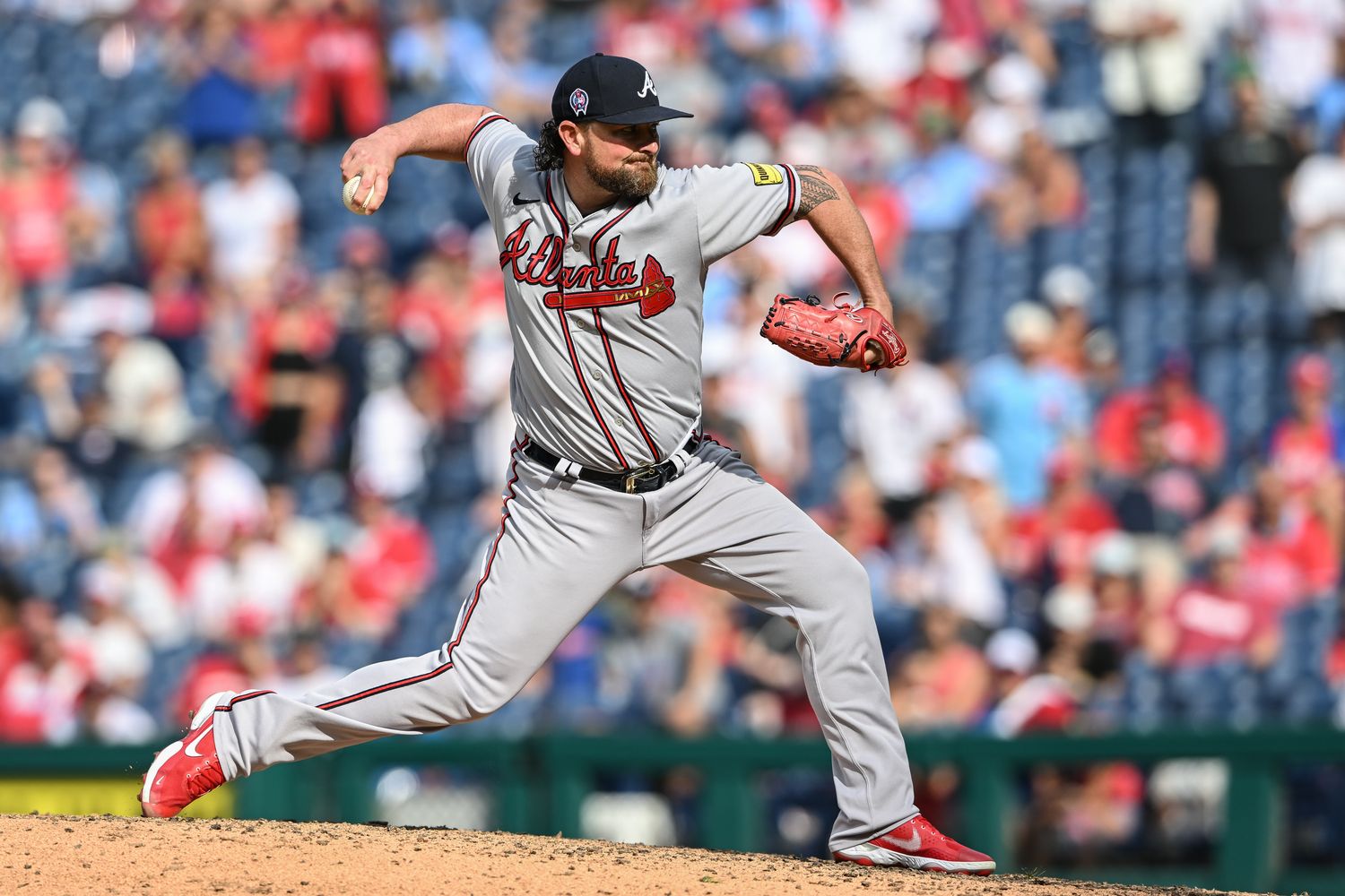 Sep 11, 2023; Philadelphia, Pennsylvania, USA; Atlanta Braves relief pitcher Kirby Yates (22) pitches in the tenth inning against the Philadelphia Phillies at Citizens Bank Park. The Braves won 10-8. Mandatory Credit: John Geliebter-USA TODAY Sports  